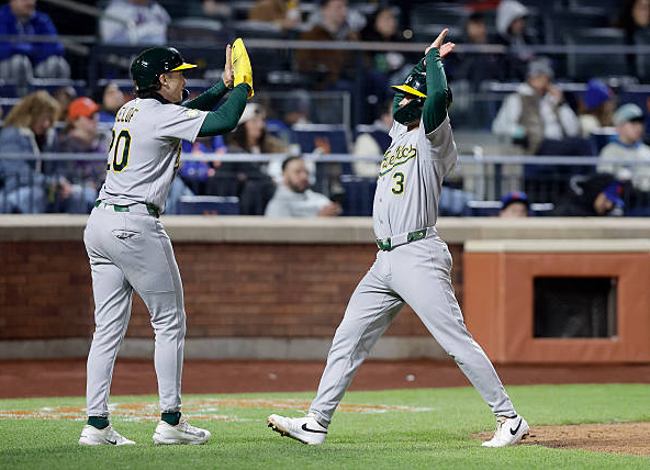 Max Muncy and Zack Gelof of the Athletics celebrating their runs in the ninth against the Mets