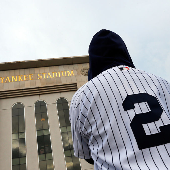 A fan wearing a Derek Jeter jersey as an example of Baseball Streetwear