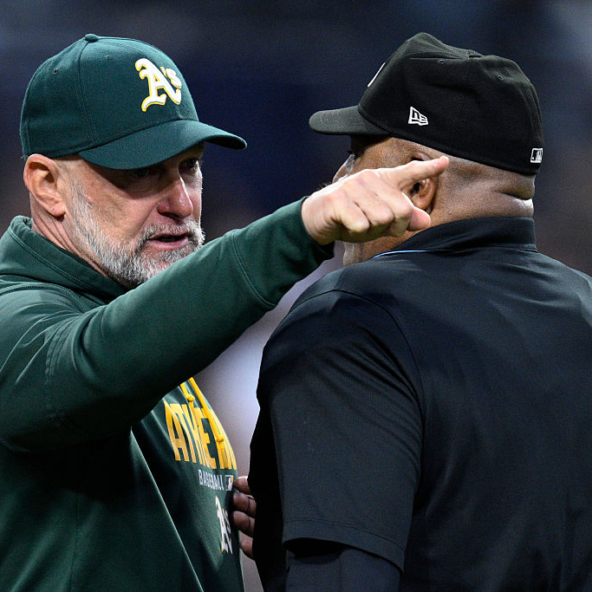 Athletics manager Mark Kotsay in a discussion with umpire Laz Diaz during his team's loss to the Padres