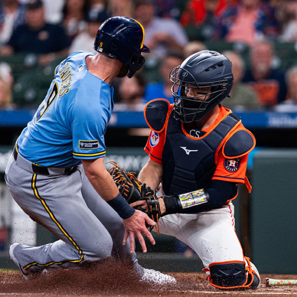 Cesar Salazar of the Astros tagging out Jake Bauers of the Brewers