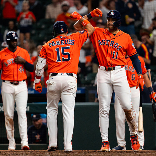 Isaac Paredes and Cam Smith of the Astros celebrating a home run against the Pirates