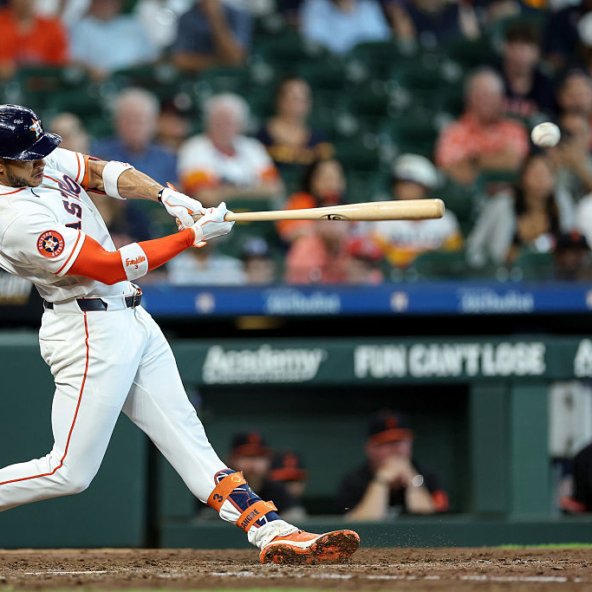 Jeremy Pena of the Astros hitting an RBI single against the Tigers