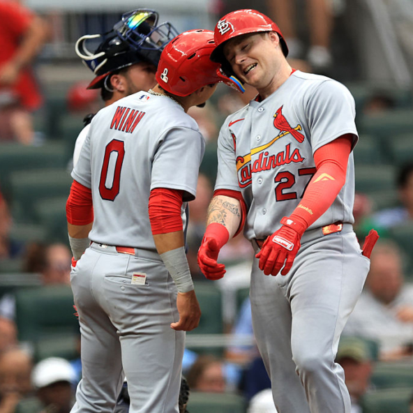 Nathan Church and Masyn Winn of the Cardinals celebrate a home run against the Braves
