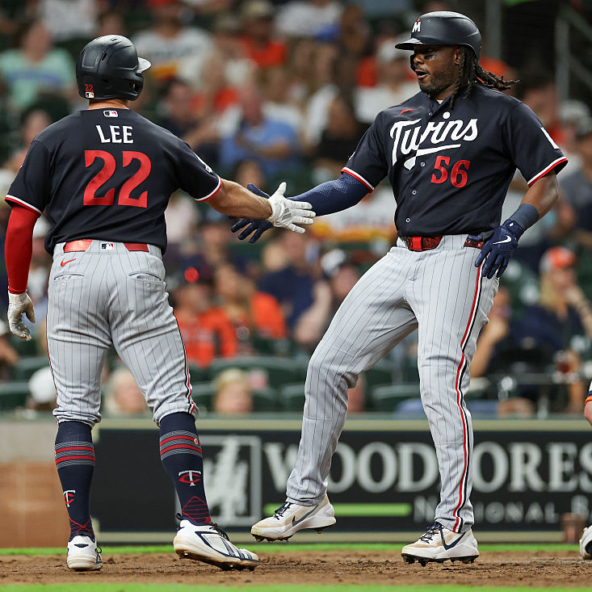 Josh Bell and Brooks Lee of the Twins celebrating a Bell homer against the Astros