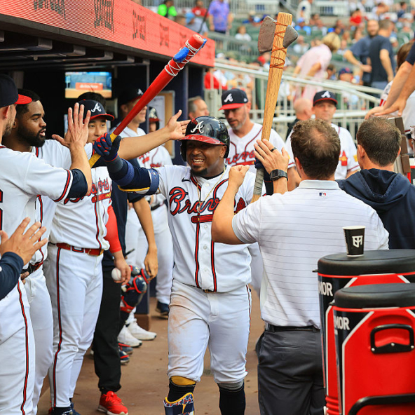Ozzie Albies of the Braves celebrating a home run against the Cardinals