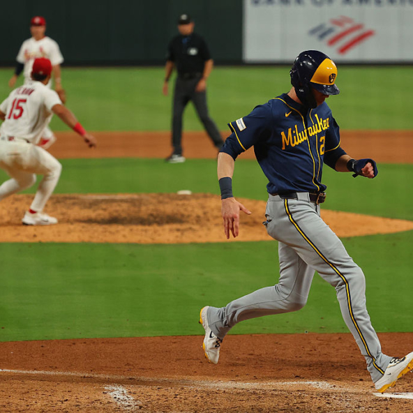 Christian Yelich of the Brewers scoring a run against the Cardinals