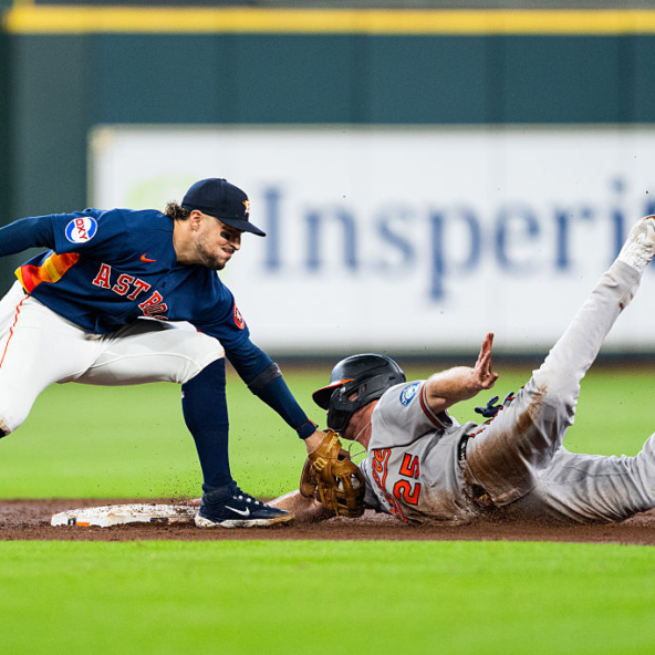 Pete Alonso of the Orioles stealing second base against the Astros