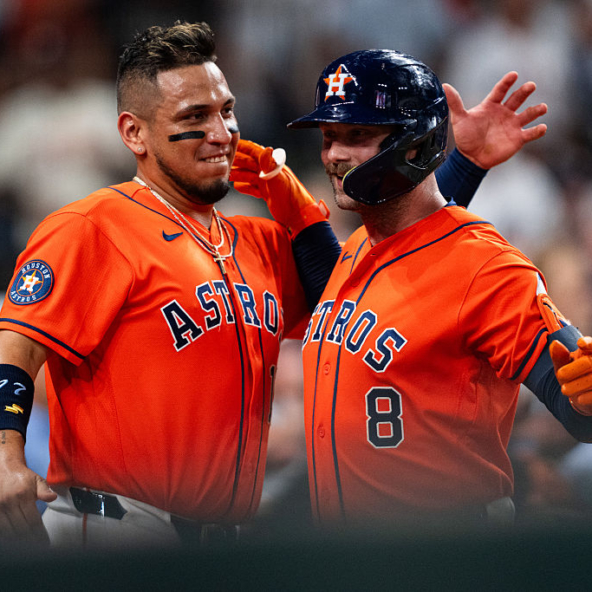 Christian Walker and Isaac Paredes of the Astros celebrating a home run against the Rangers