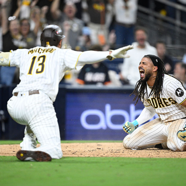 Fernando Tatis Jr and Manny Machado of the Padres celebrate a run in Game One of the 2026 NL Wild Card Series against the Cubs