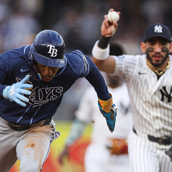 Chandler Simpson of the Rays being chased by Jose Caballero of the Yankees in a rundown
