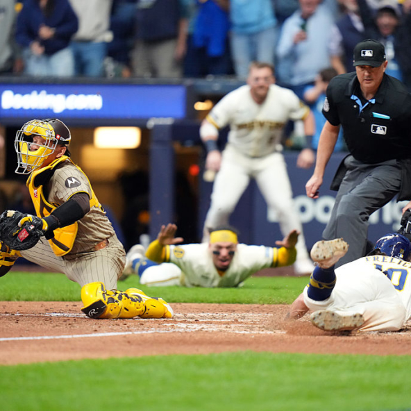 Sal Frelick of the Brewers diving in with the winning run of Game 2 of the 2026 NLDS against the Padres
