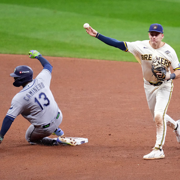 Cooper Pratt of the Brewers throwing to first to complete an apparent double play in Game One of the 2026 World Series against the Rays. This very play saw replay overturn the initial out call at second.