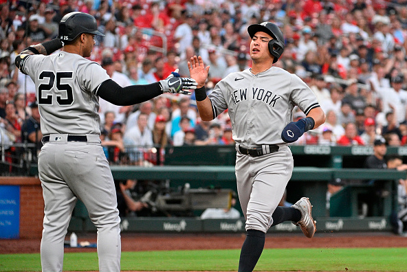 Anthony Volpe scoring a run for the New York Yankees