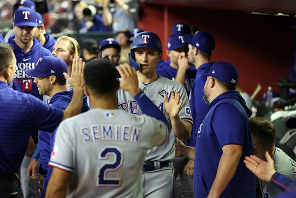 Corey Seager of the Texas Rangers celebrates his homer against the Arizona Diamondbacks in Game Four of the 2023 World Series.