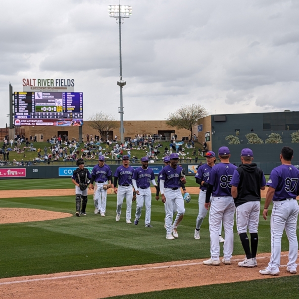 Rockies players celebrating a spring training victory over the White Sox